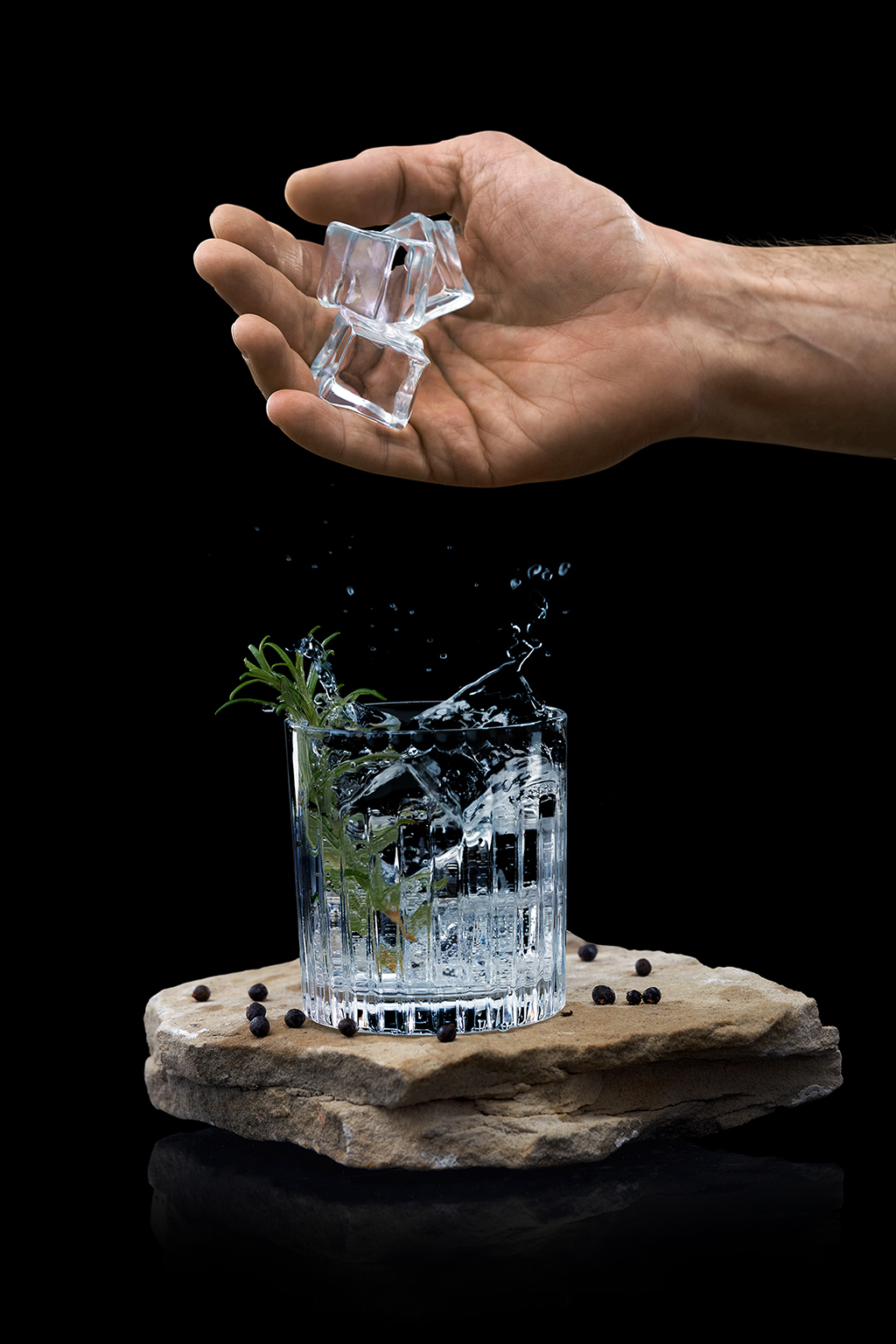 Splash with glass and ice cubes