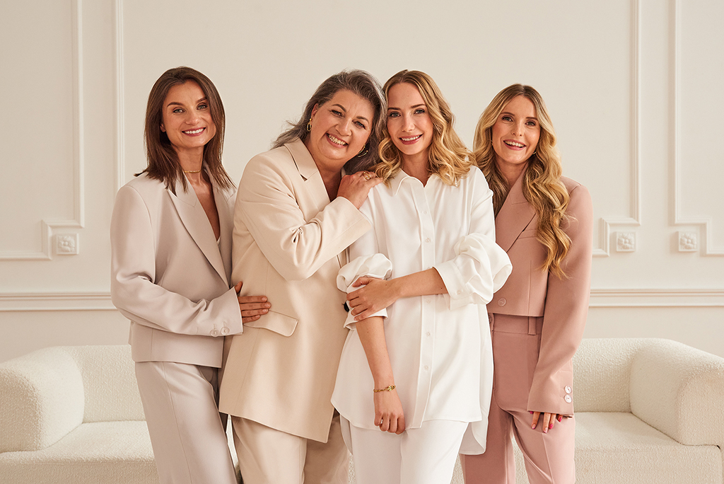 group photo of the smiling women