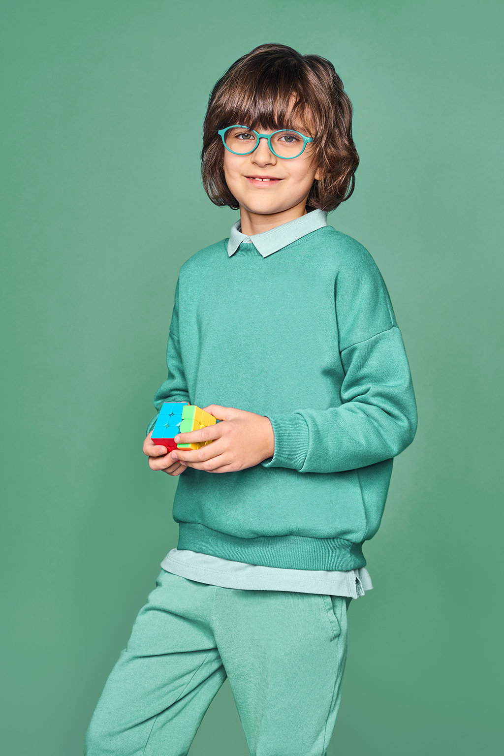 a boy with a rubik's cube