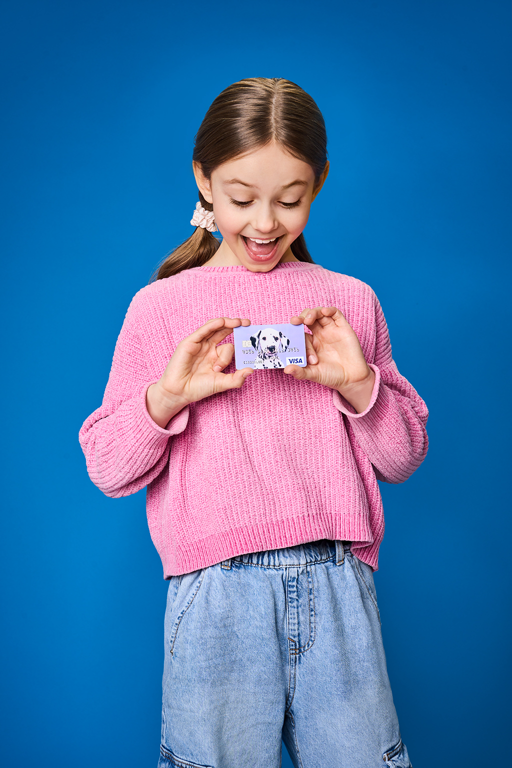 happy girl with a bank card